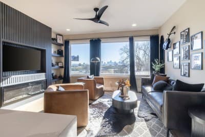 Welcome to your luxury wellness townhome in Nashville. This fully furnished, high-end retreat offers 4 private en-suite bedrooms, a sleek modern aesthetic, and an expansive open-concept living space designed for comfort and connection. Indulge in premium, spa-level amenities including a private sauna, cold plunge, and a rooftop hot tub with breathtaking skyline views. Every detail of this home is curated to deliver an exceptional, five-star experience.